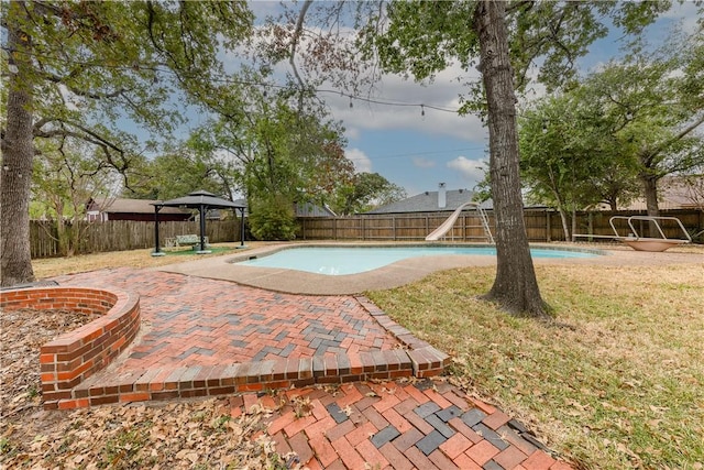 view of pool featuring a gazebo, a patio area, and a water slide