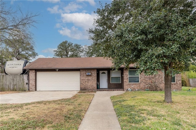 view of front of house with a front yard and a garage