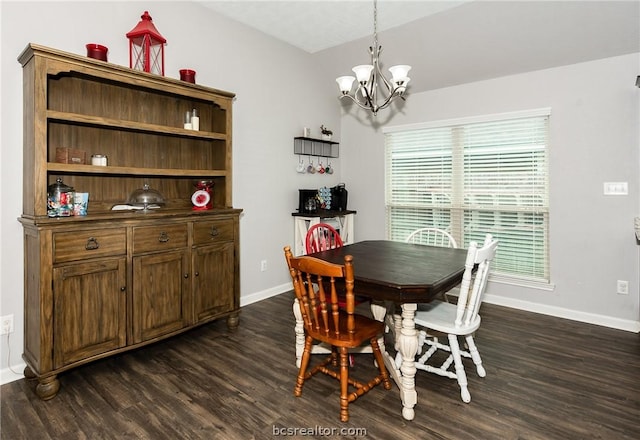 dining room with dark wood-type flooring and a chandelier