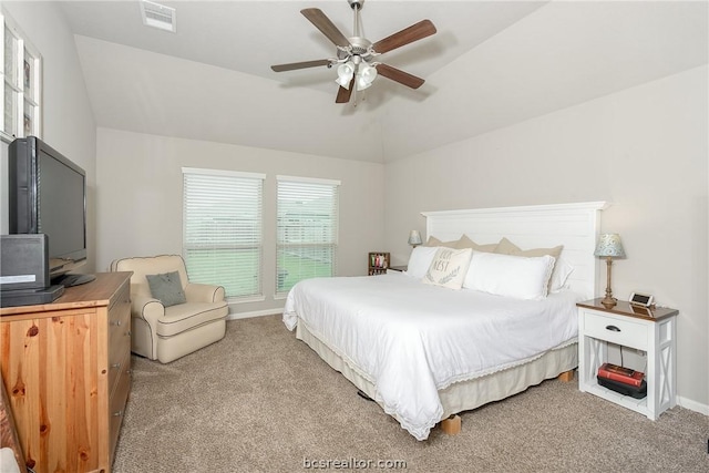 bedroom with ceiling fan, carpet floors, and vaulted ceiling