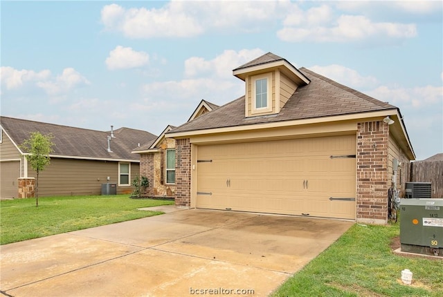 view of front of property featuring central AC, a front lawn, and a garage