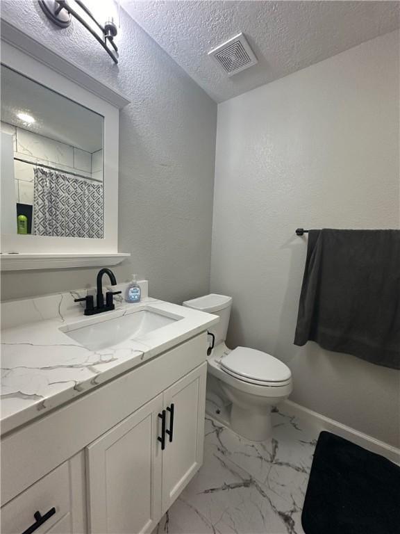 1906 Calvert Cir, Bryan, TX 77803 - full bathroom featuring vanity, a textured ceiling, marble look tile flooring, a shower with shower curtain, and a textured wall
