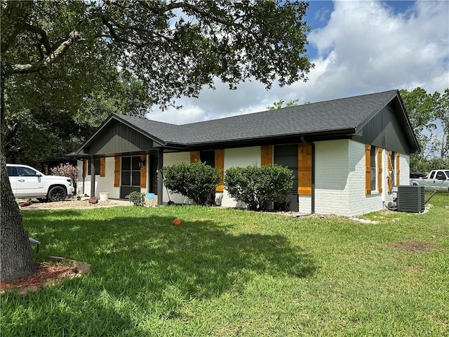 1906 Calvert Cir, Bryan, TX 77803 - view of front of home with brick siding, a front lawn, and roof with shingles