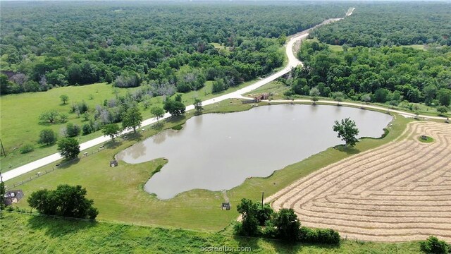 birds eye view of property with a rural view and a water view