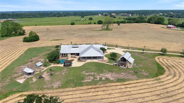 birds eye view of property with a rural view