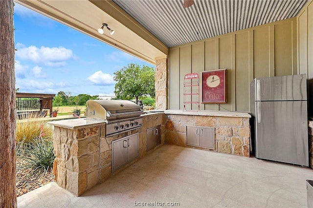 view of patio / terrace with area for grilling and exterior kitchen