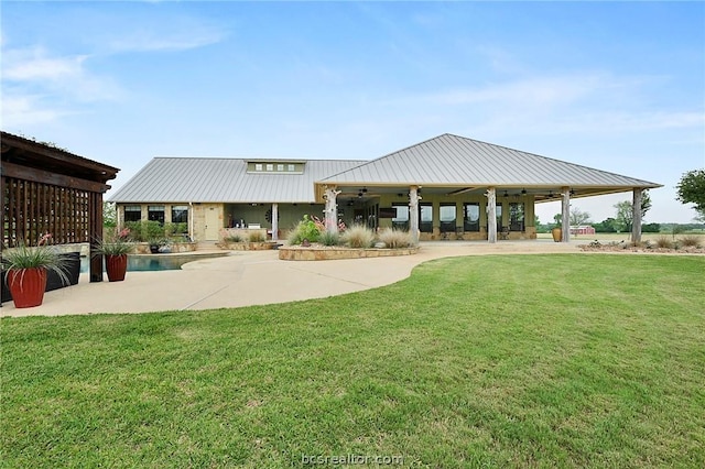 exterior space with a yard and a pool