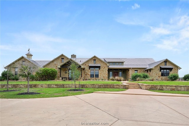 view of front of home with a front yard