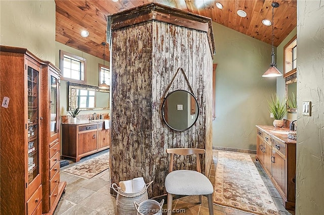 bathroom featuring vanity, wooden ceiling, and high vaulted ceiling