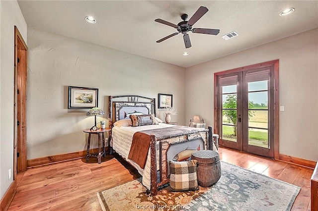 bedroom with access to exterior, ceiling fan, french doors, and light wood-type flooring