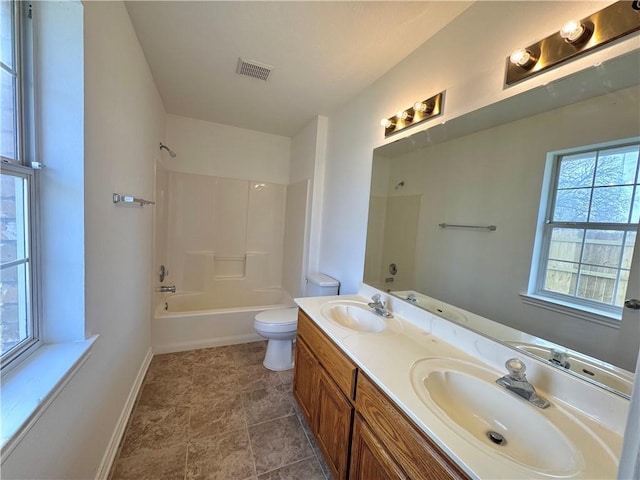 full bathroom with toilet, a sink, and visible vents