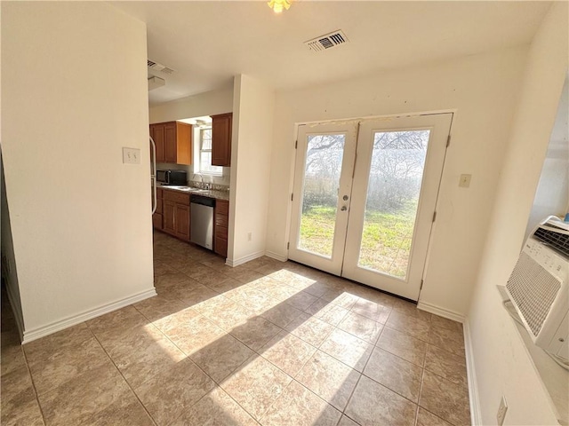 entryway featuring french doors, visible vents, baseboards, and light tile patterned floors