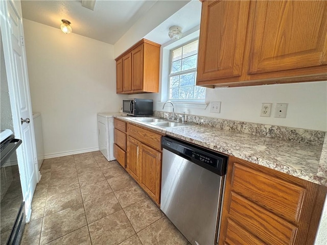 kitchen with light tile patterned floors, light countertops, stainless steel dishwasher, stove, and a sink