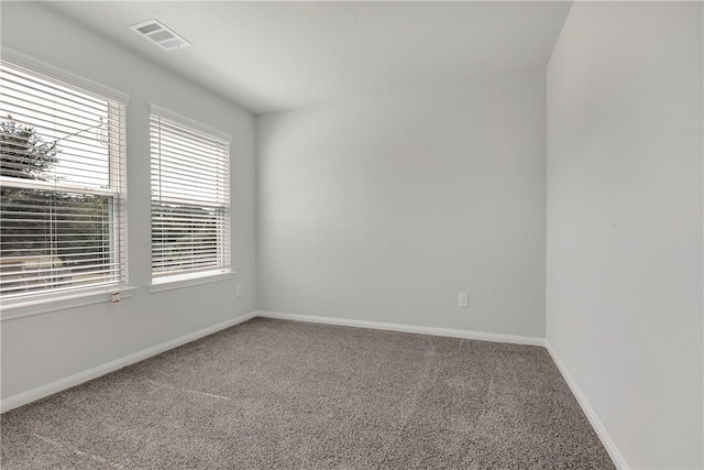 unfurnished room featuring carpet flooring