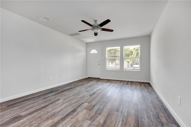 empty room with ceiling fan and wood-type flooring