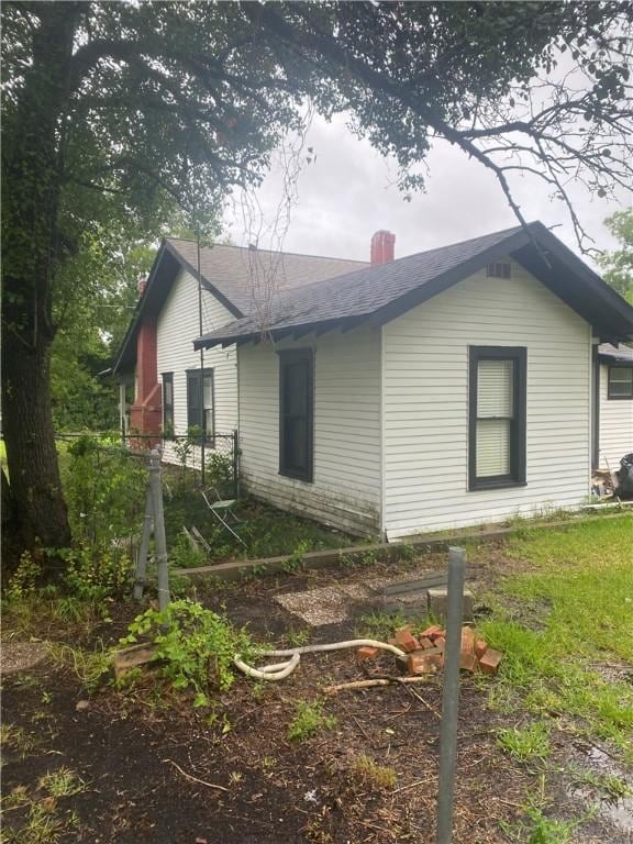 5225 Colorado St, Richards, TX 77873 - view of side of property with a chimney