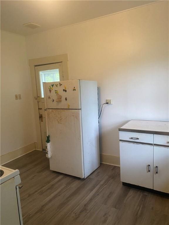 5225 Colorado St, Richards, TX 77873 - kitchen featuring white appliances and wood finished floors