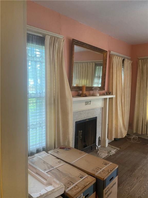 5225 Colorado St, Richards, TX 77873 - living room featuring plenty of natural light, a fireplace, and wood finished floors