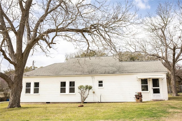 400 N Brazos St, Burton, TX 77835 - back of property featuring roof with shingles, a lawn, and crawl space