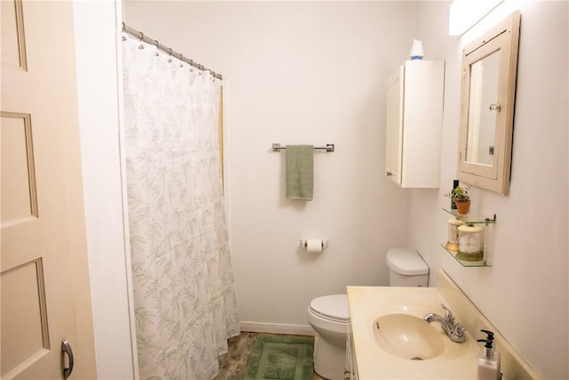 400 N Brazos St, Burton, TX 77835 - full bathroom featuring toilet, baseboards, vanity, and curtained shower