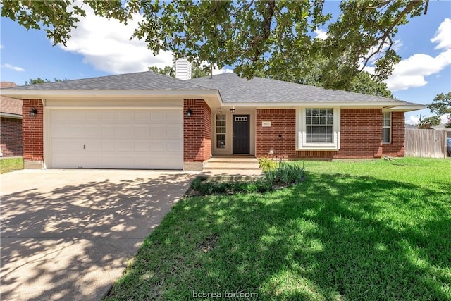 single story home with a front yard and a garage