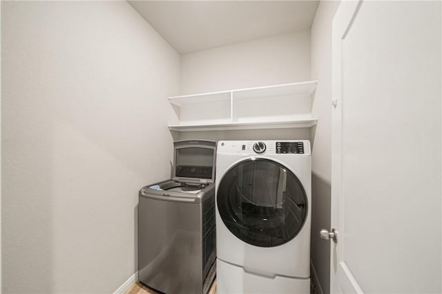 laundry room featuring washer and clothes dryer