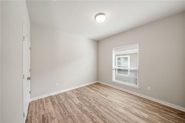 unfurnished room featuring light wood-type flooring