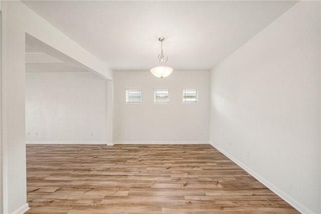 spare room with light hardwood / wood-style floors