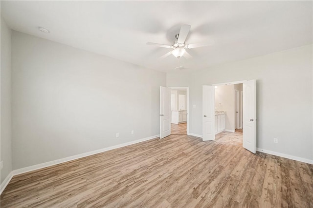 unfurnished bedroom featuring ceiling fan and light hardwood / wood-style flooring