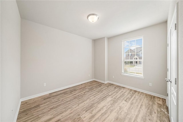 spare room featuring light wood-type flooring