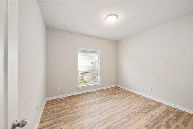 unfurnished room featuring light wood-type flooring