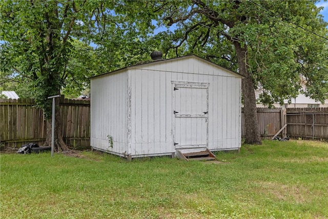 view of shed with a fenced backyard