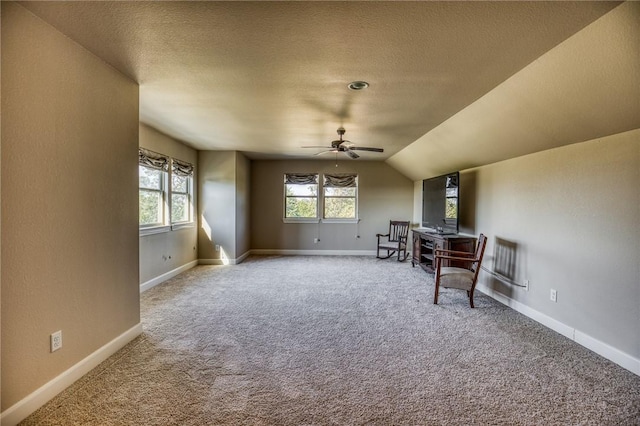 interior space with carpet, a healthy amount of sunlight, and baseboards