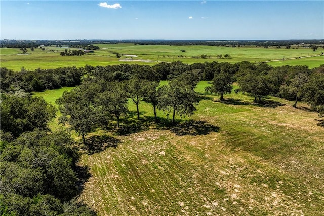 birds eye view of property with a rural view