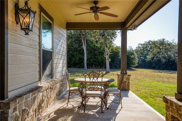 view of patio / terrace with outdoor dining space and a ceiling fan