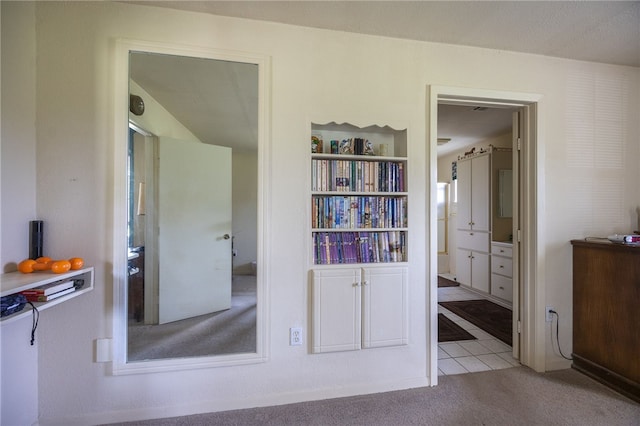 4988 Paso Fino Ln, Madisonville, TX 77864 - bedroom featuring carpet flooring, tile patterned flooring, and ensuite bathroom