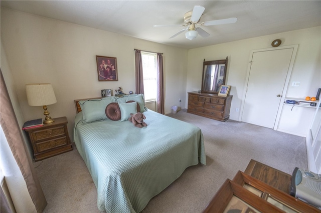 4988 Paso Fino Ln, Madisonville, TX 77864 - carpeted bedroom with ceiling fan