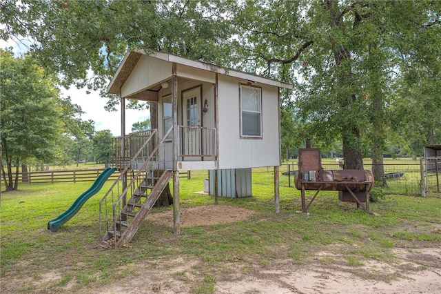 4988 Paso Fino Ln, Madisonville, TX 77864 - view of outdoor structure with a playground