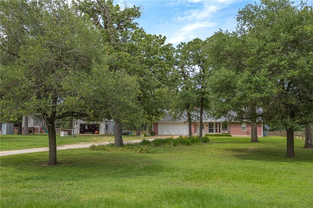 4988 Paso Fino Ln, Madisonville, TX 77864 - view of front of house featuring an attached garage