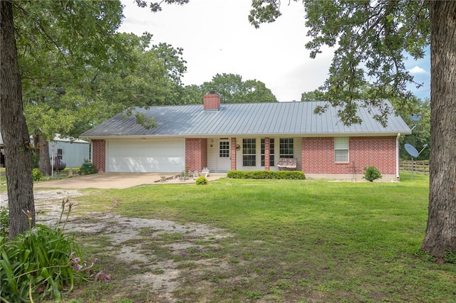 4988 Paso Fino Ln, Madisonville, TX 77864 - ranch-style home featuring concrete driveway, brick siding, a garage, a chimney, and metal roof