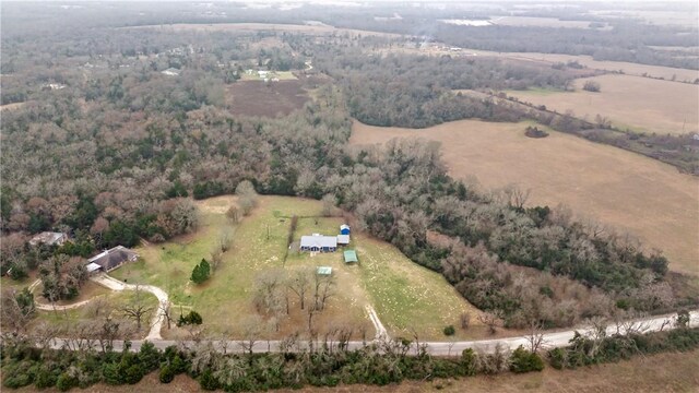 birds eye view of property with a rural view