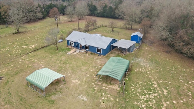 birds eye view of property with a rural view