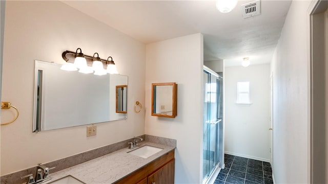 bathroom with vanity and an enclosed shower