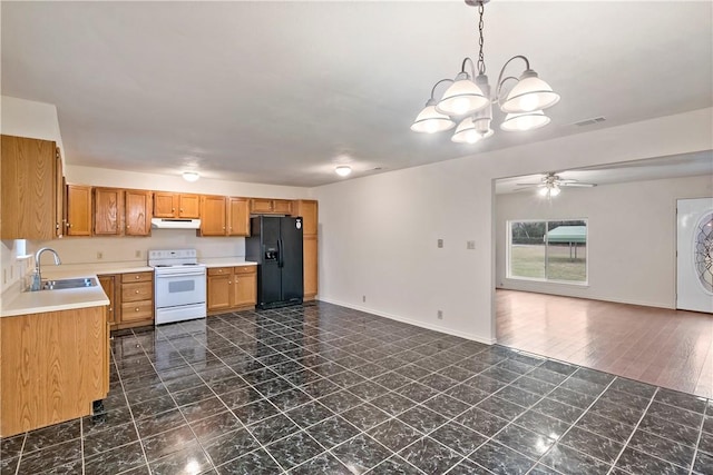 kitchen featuring pendant lighting, sink, white range with electric cooktop, ceiling fan with notable chandelier, and black refrigerator with ice dispenser