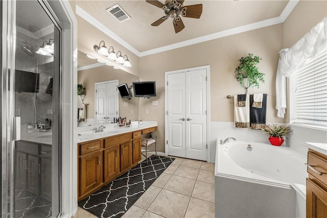 bathroom with plus walk in shower, tile patterned flooring, vanity, ceiling fan, and crown molding