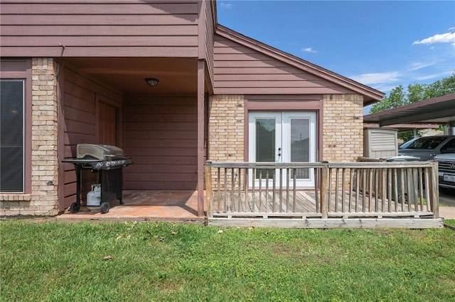 exterior space featuring french doors and brick siding