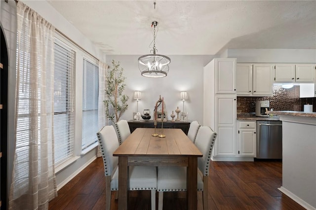 dining space featuring an inviting chandelier, baseboards, and dark wood-type flooring