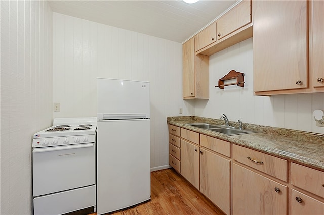 kitchen with white appliances, light wood-type flooring, and light brown cabinets