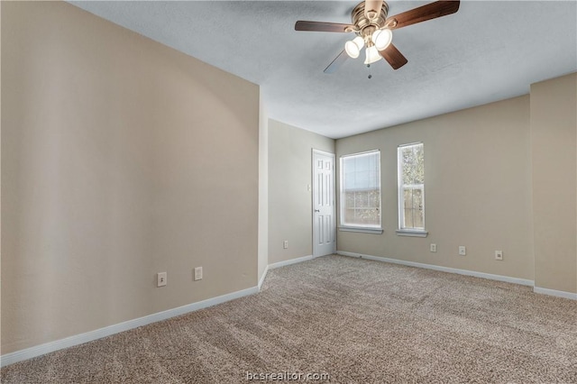 unfurnished room featuring a textured ceiling, carpet floors, and ceiling fan