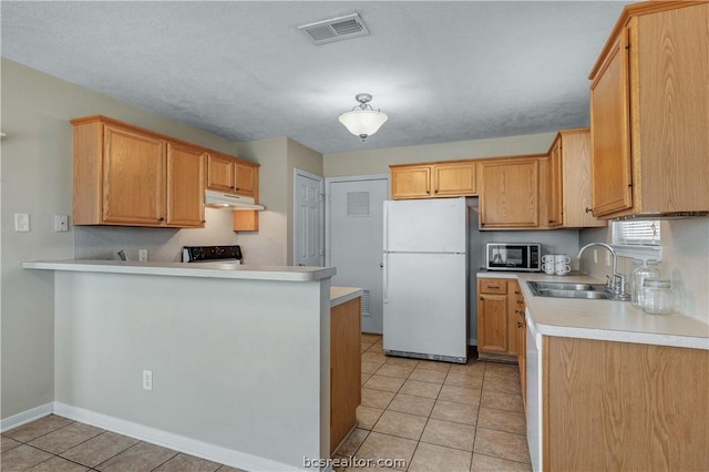 kitchen featuring sink, light brown cabinets, kitchen peninsula, white appliances, and light tile patterned flooring